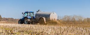 Tractor with slurry tank in the field